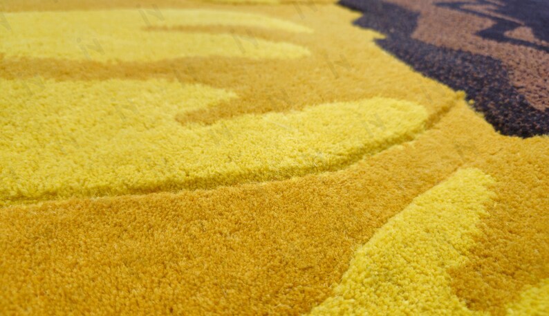 IN-108 Hand Tufted Sunflower Woolen Carpet for Floor Decor, Cozy Home,Bedroom, Courtyard, Living Room, Kids, Cabin, Bedroom, Reading Nook.
A vibrant sunflower-shaped wool rug handcrafted in rich yellow and brown tones, featuring realistic petal textures and a plush wool surface. Displayed in a bright minimalist room with indoor plants, natural sunlight, and a wooden bench, this handmade rug adds a cheerful botanical touch and cozy warmth to any modern living space.