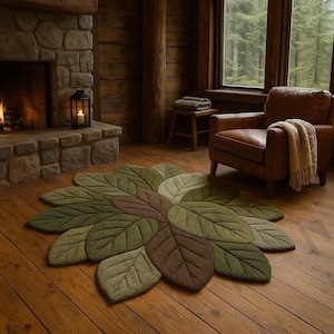 Alfombra con forma de hoja, tejida a mano en lana con diseño botánico en verde y marrón.