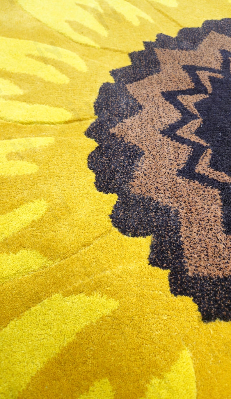 IN-108 Hand Tufted Sunflower Woolen Carpet for Floor Decor, Cozy Home,Bedroom, Courtyard, Living Room, Kids, Cabin, Bedroom, Reading Nook.
A vibrant sunflower-shaped wool rug handcrafted in rich yellow and brown tones, featuring realistic petal textures and a plush wool surface. Displayed in a bright minimalist room with indoor plants, natural sunlight, and a wooden bench, this handmade rug adds a cheerful botanical touch and cozy warmth to any modern living space.