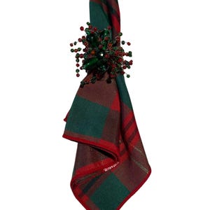 May include: A white ceramic mug with a black handle and the text "But First, Coffee" in a black, bold font. The mug is on a white surface.