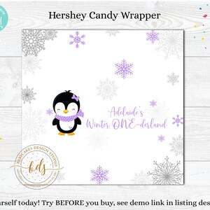 May include: A printable Hershey's candy wrapper featuring a penguin wearing a purple scarf and a bow. The wrapper has a white background with gray and purple snowflakes and the text "Adelaide's Winter ONE-derland".