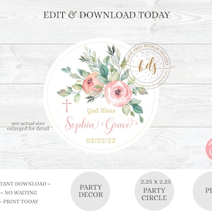 May include: A round, white, printable party circle with a floral design and the text "God Bless Sophia Grace 02/22/22". The circle is surrounded by a gold border and has a cross in the upper left corner. The text "Babycakes Design Studio" is in a gold circle in the upper right corner.
