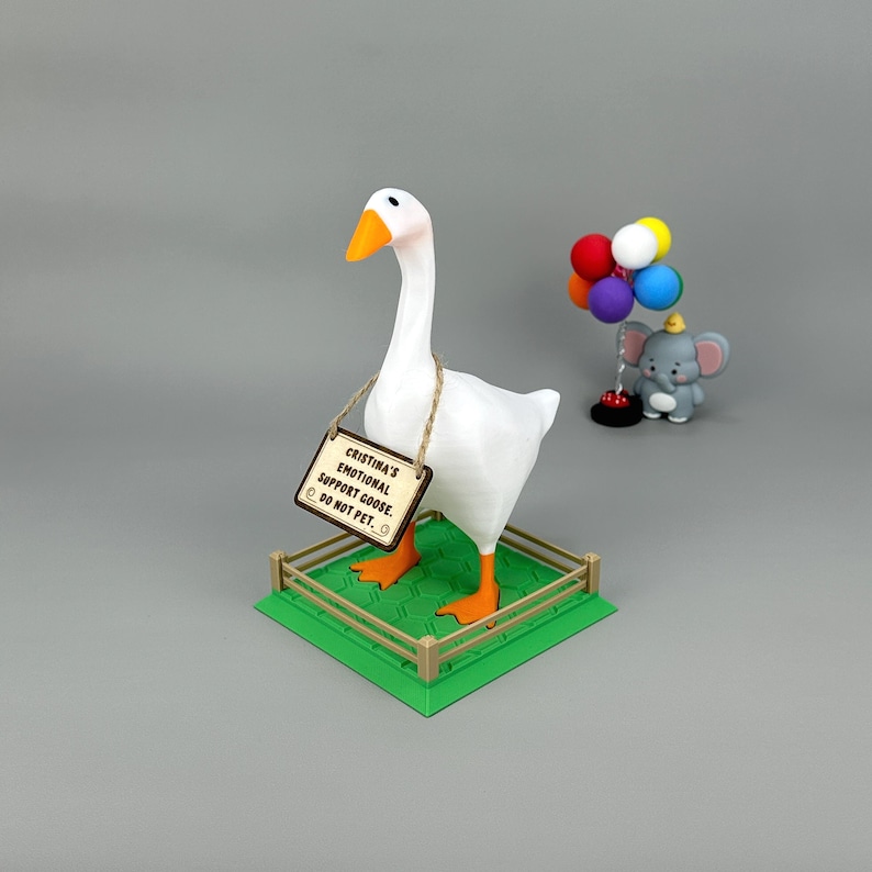 Funny emotional support goose desk figurine on faux grass base with customizable magnetic wooden sign – quirky office gift for coworkers and gamers.