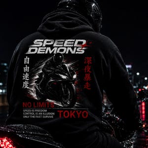 May include: A black hooded sweatshirt featuring a graphic of a motorcycle rider. The text reads SPEED DEMONS, NO LIMITS, TOKYO, SPEED IS FREEDOM, CONTROL IS AN ILLUSION, ONLY THE FAST SURVIVE, and Japanese characters. The design includes red and white accents.