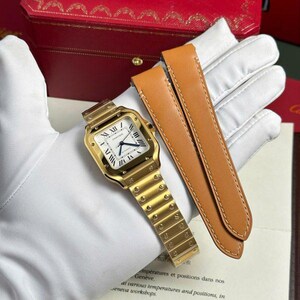 Reloj Cartier Santos Gold de 40 mm con esfera. Incluye caja, etiqueta y documentación.