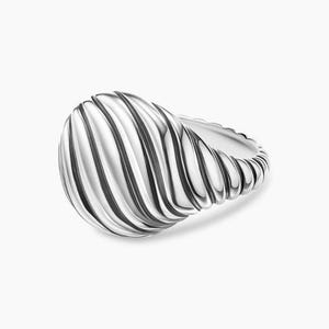 May include: A silver ring with a textured, ridged design on the oval-shaped face. The band has a twisted rope-like texture. The ring is set against a white background, highlighting its polished, reflective surface.