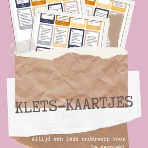 May include: A collage of printed cards with conversation prompts, layered over torn brown paper and white paper, against a pink background. The text "KLETS-KAARTJES" is printed in a typewriter font. The text "Altijd een leuk onderwerp voor je gesprek!" is also visible.