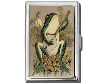 Estuche para cigarrillos o tarjetero con forma de rana tocando el banjo
