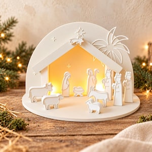 May include: A white wooden nativity scene set featuring a stable arch with a star and palm tree cutout. The set includes figurines of a cow, sheep, donkey, Mary, Joseph, the baby Jesus in a manger, and three kings, all illuminated by a warm light.