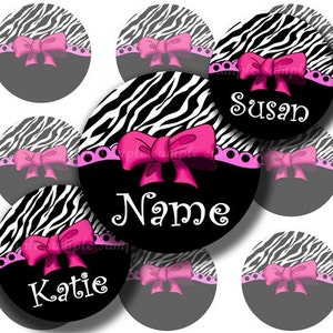 May include: Ten round black and white zebra print stickers with pink bows and white text. The text on the stickers says "Name", "Susan", and "Katie".