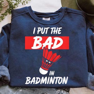 Badminton Shirt Funny – I Put The BAD In Badminton Sweatshirt – Red Shuttlecock Sports Tee – Badminton Player Gift – Racket Sports Shirt