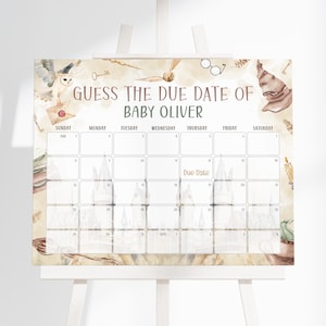 May include: A baby shower calendar on an easel, featuring a watercolor design with a Hogwarts theme. The calendar is labeled "Guess the Due Date of Baby Oliver" and includes a grid for guests to write their guesses. The design includes an owl, glasses, and a sorting hat.