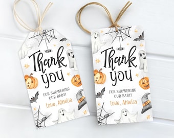 May include: Two Halloween-themed gift tags with the text "Thank you" and "For showering our baby! Love, Amelia." The tags feature illustrations of pumpkins, ghosts, bats, spiderwebs, and witch hats, with a twine string.