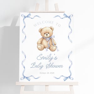 Vi kan nog vänta babyshower-välkomstskylt | Välkomsttavla med nallebjörn | Babyshower-dekor med nallebjörn | Välkomstaffisch med blå rosett och björn | SB5