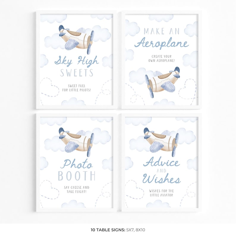 May include: Four framed signs with a baby shower theme. Each sign features a watercolor illustration of a biplane and clouds. Text on the signs includes "Sky High Sweets", "Make an Aeroplane", "Photo Booth", and "Advice and Wishes".