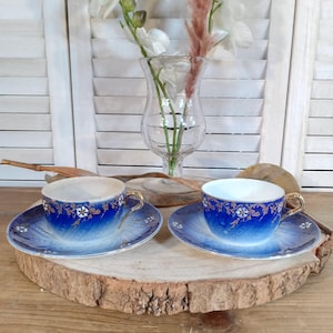 Antique pair of Luneville porcelain cups and saucers with floral decoration and gilding, vintage French