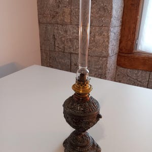 Antique oil lamp in decorated metal