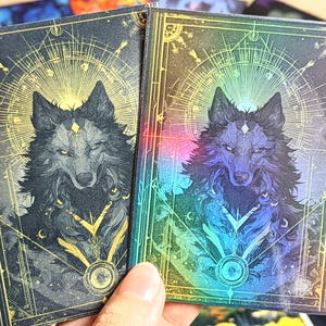 May include: A set of three ceramic mugs with a speckled, matte finish in blue, green, and white. Each mug has a simple, modern design, suitable for coffee or tea. The mugs are stacked on top of each other.