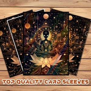 May include: Card sleeves featuring an alien meditating on a lotus flower, with a cosmic background in shades of black, gold, and orange. The text "TOP QUALITY CARD SLEEVES" is at the bottom. The design has intricate line art.