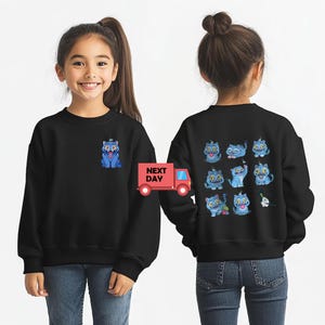 May include: Black sweatshirt featuring a blue cartoon cat on the front and a collection of blue cat illustrations on the back. The sweatshirt is worn by a young girl. A red truck with the words "NEXT DAY" is also visible.