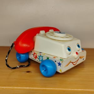 Retro Pull along Phone Toy: Timeless Fun for Kids Today