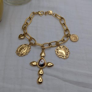 Steel bracelet with gold charms