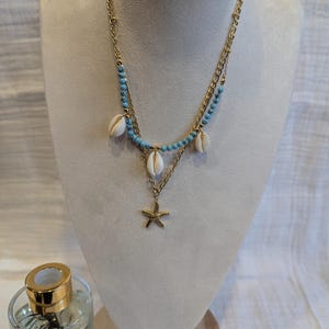Gold-plated steel necklace with shell charms