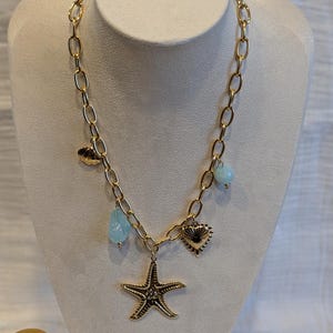 Gold-plated steel necklace with starfish charms