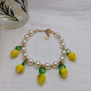 Steel bracelet with charms and beads