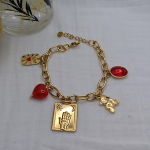 Steel bracelet with gold charms