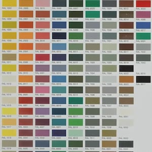 May include: A comprehensive RAL color chart featuring a grid of numerous rectangular color swatches, each labeled with its specific RAL code. The chart displays a wide spectrum of hues including yellows, oranges, reds, blues, greens, grays, and browns.