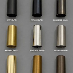 May include: A grid of nine cylindrical metal sleeves in various finishes: matte black, antique black, blackened brass, brushed brass, polished chrome, brushed chrome, polished brass, raw brass, and antique patina, each labeled with its finish name.