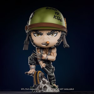 May include: A stylized figurine of a character in a military helmet with the words "Born to Kill". The figure has a cigar, claws, and camouflage pants. The figure is standing on a rock with a belt of bullets.