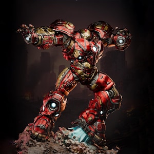 May include: A detailed figurine of a red and gold armored robot in a dynamic pose, with glowing blue accents. The figure is standing on a rocky base, with a blurred cityscape in the background.