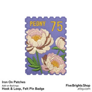 May include: Embroidered patch with peony flowers in pink, cream, and brown on a lavender background. The patch is shaped like a postage stamp and features the word "PEONY" and the number "75" in yellow.
