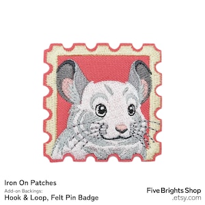 May include: Embroidered patch featuring a chinchilla design. The patch is in the shape of a postage stamp with a red background and a cream-colored border. The chinchilla is gray and white with large, dark eyes.