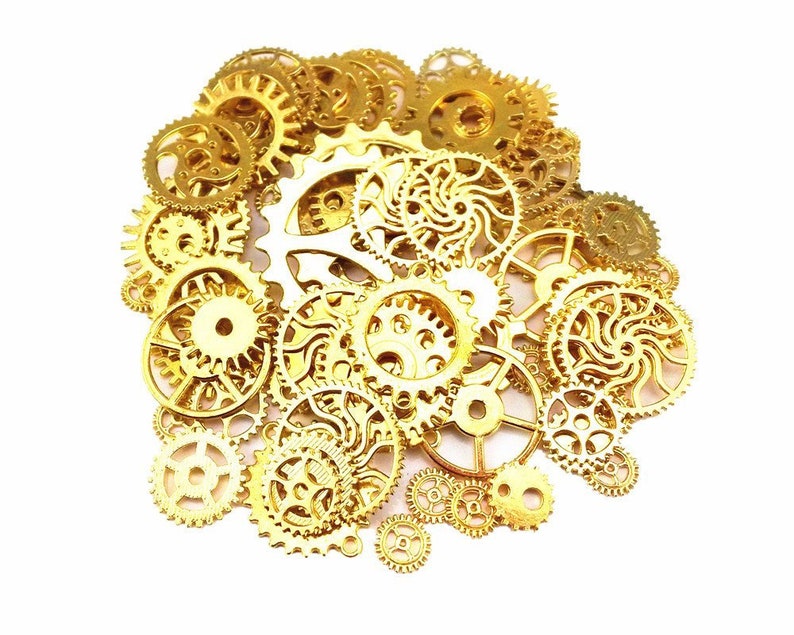 May include: A collection of various sizes of gold-colored gears, cogs, and clockwork components, arranged in a circular shape against a white background. The gears have intricate designs and are likely used for steampunk or mechanical projects.