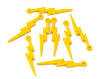 May include: A set of nine yellow lightning bolt charms with a hole at the top for attaching to jewelry or other crafts.