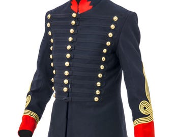 May include: A navy blue military-style jacket with gold buttons and trim. The jacket features a high collar with red accents, gold embroidery on the sleeves, and red cuffs. The jacket is a formal garment.