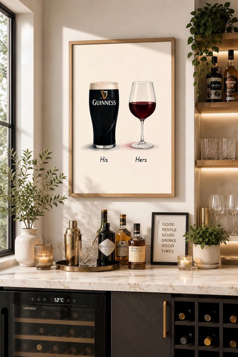 May include: A framed print featuring a pint of Guinness and a glass of red wine, labeled "His" and "Hers." The image is set above a bar with bottles of liquor, a cocktail shaker, and a sign that reads "Good People Good Drinks Good Times."
