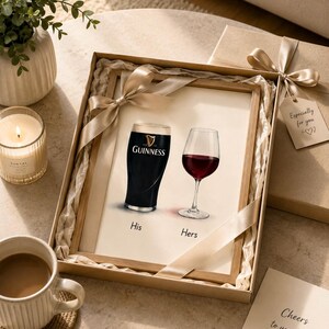 May include: A framed print featuring a pint of Guinness and a glass of red wine, labeled "His" and "Hers." The print is in a gift box with a ribbon and a tag that says "Especially for you." A card reads "Cheers to you both."