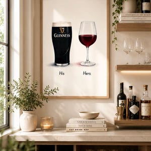 May include: A framed print featuring a pint of Guinness and a glass of red wine, labeled "His" and "Hers." The image is set in a home bar with wine bottles, glasses, and decorative items. The text "LIVE BEAUTIFULLY" is visible.