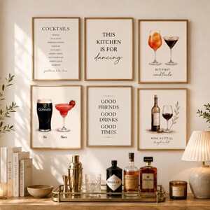 May include: A collection of framed art prints with a bar theme. The prints feature cocktail recipes, inspirational quotes, and illustrations of drinks like cocktails, wine, and beer. The color palette is neutral with a touch of gold.
