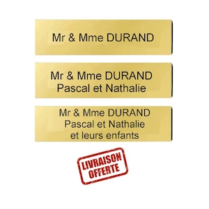 Peut inclure: Trois étiquettes dorées rectangulaires avec texte noir. La première lit "Mr & Mme DURAND". La seconde ajoute "Pascal et Nathalie". La troisième inclut "et leurs enfants". Un tampon rouge indique "LIVRAISON OFFERTE".