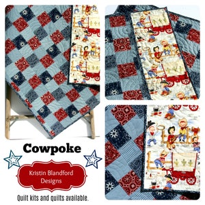 May include: A patchwork quilt with a cowboy theme. The quilt is made of blue and red fabric with a checkered pattern. The quilt is quilted with a curved design. The quilt is labeled "Cowpoke Kristin Blandford Designs Quilt kits and quilts available."