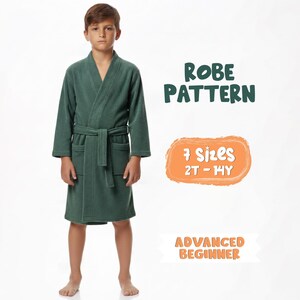 May include: A young person wearing a green robe. The image includes text that reads "ROBE PATTERN", "7 Sizes 2T - 14Y", and "ADVANCED BEGINNER". The robe has a belt and pockets.