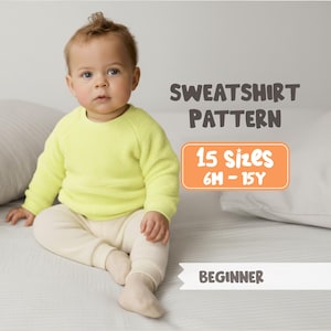 May include: A baby wearing a neon yellow sweatshirt and cream-colored pants. The image includes text that reads "SWEATSHIRT PATTERN", "15 Sizes 6M - 15Y", and "BEGINNER". The baby is sitting on a bed with pillows.