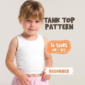 May include: A young girl wearing a white tank top. The image includes text that reads "TANK TOP PATTERN", "16 Sizes 6M - 16Y", and "BEGINNER". The tank top is a simple, sleeveless design.