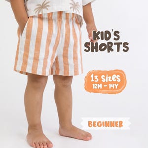 May include: Striped shorts in orange and white with an elastic waistband and side pockets. Text on the image reads: KID'S SHORTS, 13 Sizes 12M - 14Y, and BEGINNER. The shorts are worn with a white shirt featuring a palm tree pattern.