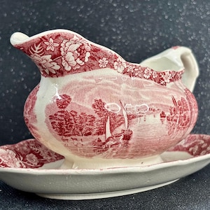 Könnte beinhalten: Ein Set aus drei Keramikbechern mit gesprenkelter, matter Oberfläche. Die Becher sind in Creme-, Hellgrau- und Dunkelgrautönen gehalten. Jeder Becher hat ein schlichtes, minimalistisches Design.